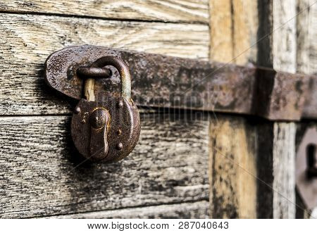 Old Rusty Keylock Protecting Something Behind The Door.