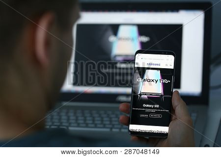 Minsk, Belarus - February 16, 2019 : Man Holding Samsung Galaxy S 10 Plus In Hand Illustrative Edito