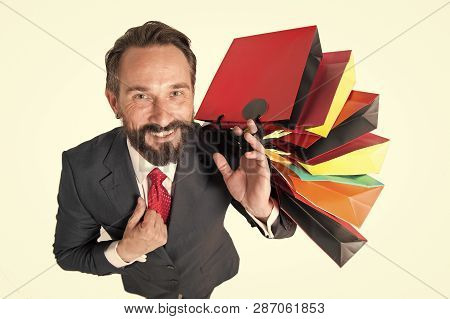 Handsome Beaded Man With Lot Of Shopping Bags Top View. Man In Suit Happy From Shopping Time And Pre