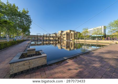 The Hague, 7 May 2018 - Reflection Of The Museon, The Municipality Museum Under A Blue And Shiny Spr