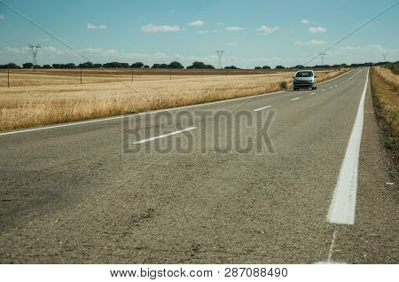 Road Through Rural Landscape And Car Near The Monfrague National Park