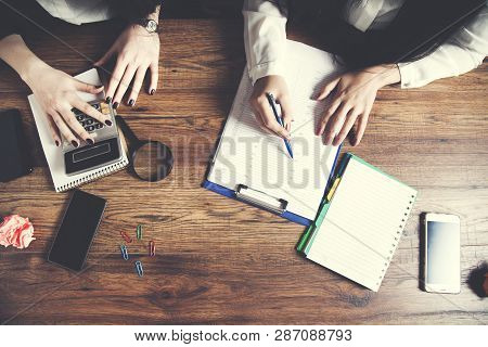 Two Business  Woman Working In Office Table