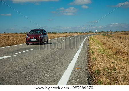Road Through Rural Landscape And Car Near The Monfrague National Park