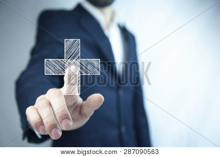 Man Touching Plus Or Cross Sign In Screen