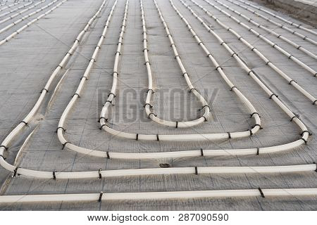 Underfloor Heating System Installation. Close Up On Water Floor Heating System Interior Of A New Ind