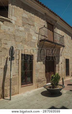 Stone Building And Balcony In Quiet Street At Merida