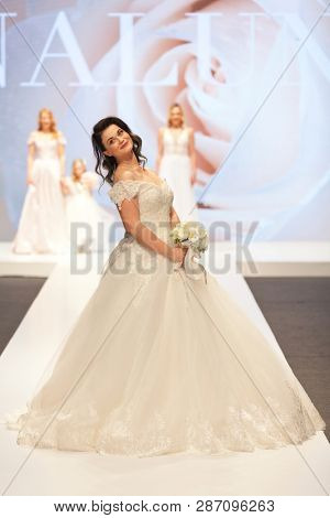 ZAGREB, CROATIA - FEBRUARY 02, 2019: Croatian singer Romana Pavlisa in a wedding dress walking down the runway at the Wedding fair