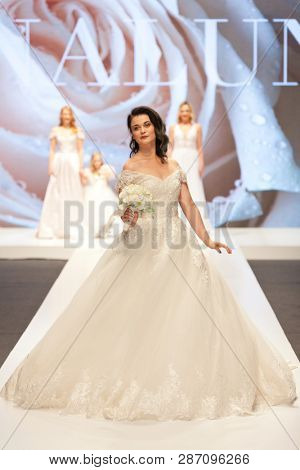 ZAGREB, CROATIA - FEBRUARY 02, 2019: Croatian singer Romana Pavlisa in a wedding dress walking down the runway at the Wedding fair