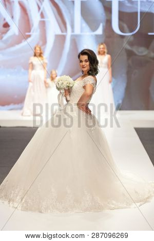 ZAGREB, CROATIA - FEBRUARY 02, 2019: Croatian singer Romana Pavlisa in a wedding dress walking down the runway at the Wedding fair