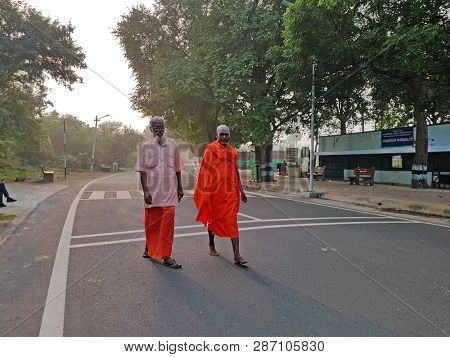 Tiruvanamalai, India -December 11, 2019: Doing pradakshina, walking around the mountain Arunachala in Tiruvanamalai in India