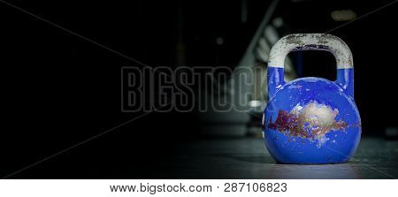 Kettle Bell Sport, Heavy Old Used Color Kettlebell Weight On The Gym Floor Ready For Fitness Strengt