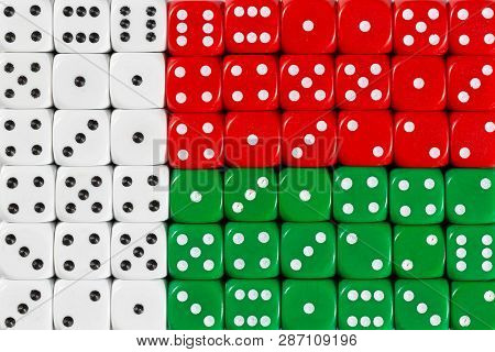 National Flag Of Madagaskar In Colorful Background Of Dices