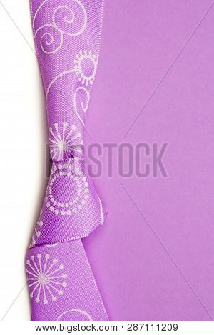 Birthday Gift Card With Violet Bow And Ribbon In The Middle Isolated And Violet And Blue Background 