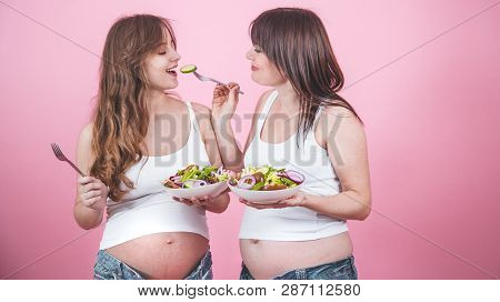 Maternity Concept, Two Pregnant Woman Eating Fresh Salad