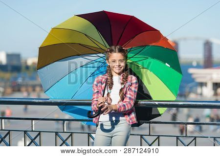 Positive And Bright. Girl Cute Child Standing With Colorful Umbrella. Child Under Umbrella. Colorful