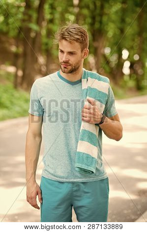 Tired Man. Tired Man With Towel Relax After Training In Forest. Man Tired After Running In Park. Man