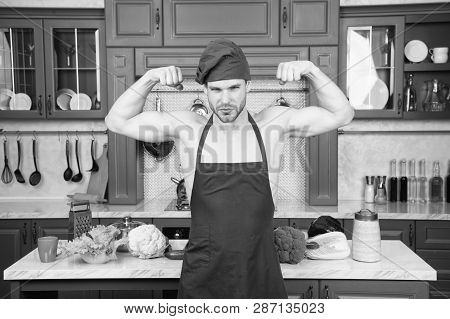 Sexy Muscular Chef In Front Of Kitchen. Attractive Chef Ready To Cook. Muscular Chef Posing In Kitch