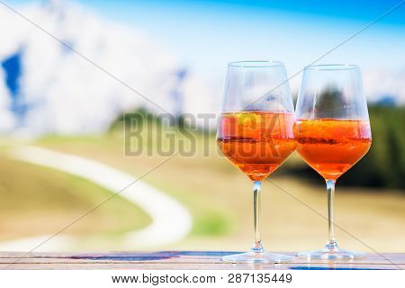 Two Glasses Of Delicious Aperol Spritz Cocktail On Blurred Background