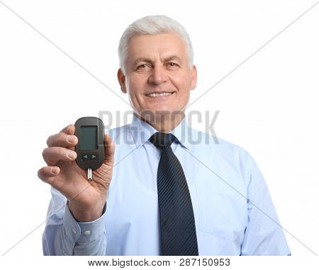 Senior Man Holding Glucometer On White Background. Diabetes Control