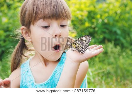 Child With A Butterfly. Idea Leuconoe. Selective Focus.
