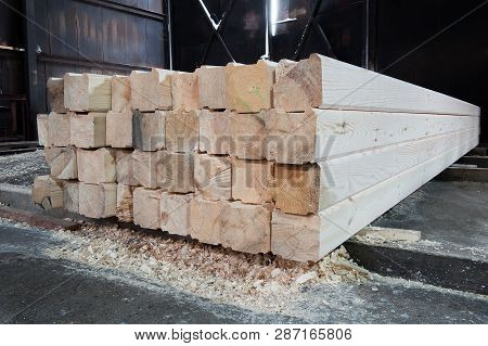 Wood At The Sawmill. Boards Are Stacked. Ready For Sales. Lumber Is Stored In The Warehouse.