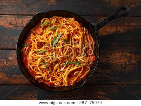 Spaghetti Alla Amatriciana With Pancetta Bacon, Tomatoes And Pecorino Cheese. Served In Cast Iron Sk