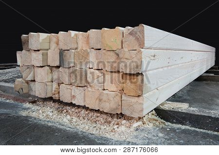 Wood At The Sawmill. Lumber Is Stored In The Warehouse.