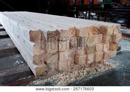 Wood At The Sawmill. Lumber Is Stored In The Warehouse.
