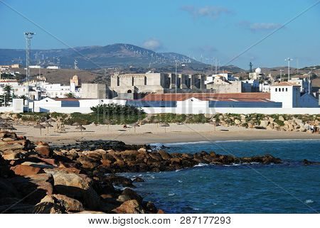 Tarifa, Spain - September 14, 2008 - View Of A Rocky Coastline Towards The Beach, Castle And Town Se
