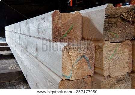 Wood At The Sawmill. Lumber Is Stored In The Warehouse.