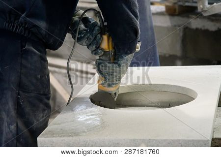 Man Polishing Marble Stone Table By Small Angle Grinder. Stone Cutter