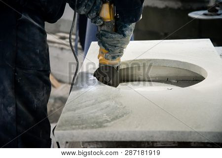 Man Polishing Marble Stone Table By Small Angle Grinder. Stone Cutter