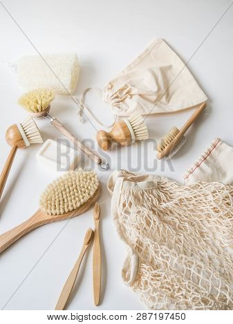 Dish Washing Brushes, Bamboo Toothbrushes, Reusable Bags On White Background. Sustainable Lifestyle 