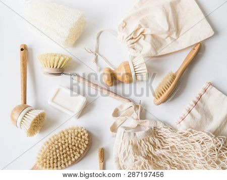 Dish Washing Brushes, Bamboo Toothbrushes, Reusable Bags On White Background. Sustainable Lifestyle 