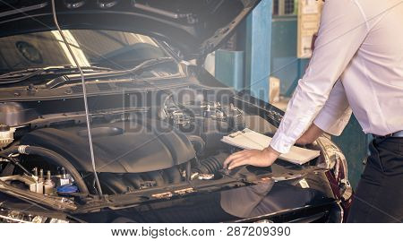 This Career Man Saleman Business Inspection Writing Note On Notepad Or Book, Paper With Car Blurry B