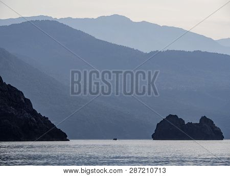 Waves And Beautiful Sunset On The Greek Island Evia (euboea) In The Aegean Sea