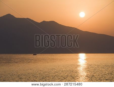 Waves And Beautiful Sunset On The Greek Island Evia (euboea) In The Aegean Sea