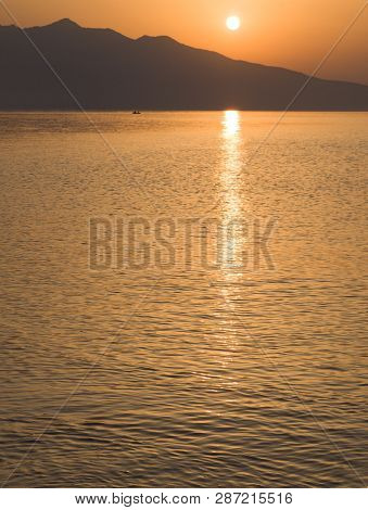 Waves And Beautiful Sunset On The Greek Island Evia (euboea) In The Aegean Sea