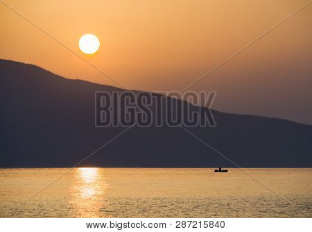 Waves And Beautiful Sunset On The Greek Island Evia (euboea) In The Aegean Sea