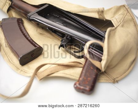 Studio Shot Of Machine Gun And Magazine, Wrapped In A Cloth Bag