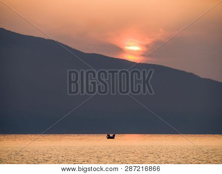 Waves And Beautiful Sunset On The Greek Island Evia (euboea) In The Aegean Sea