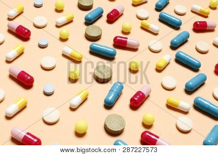 Multi-colored Vitamins On A Pink Background. Place For Text. Top View.