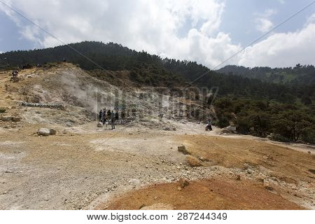 Dieng Plateau, Indonesia - August 06, 2017: Clouds Emerging From Sikidang, Dieng Plateau, Indonesia.