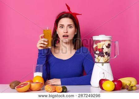 Close Up Of Brunette Woman With Glass Of Fresh Orange Juice In Hand. Lady Likes Healthy Eating, Maki