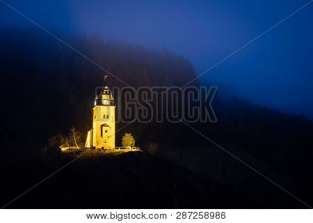 View From Small Mining City Erzberg To Yellow Lighten Shift Tower Schichtturm On A Misty Evening In 