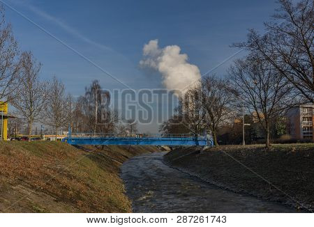 Blue Pipes Over Bilina River In Bilina Town In Winter Sunny Morning