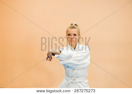 Young Girl Dressed In Hakama Practicing Aikido