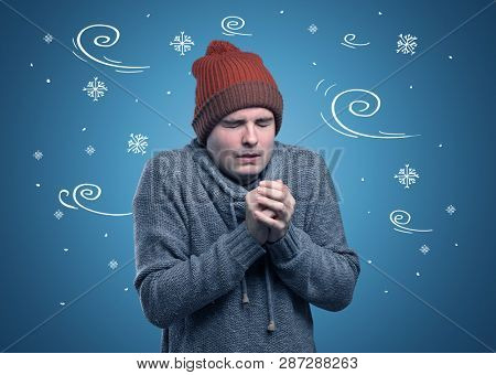 Young hipster frozen boy with doodled snowflakes and windy concept