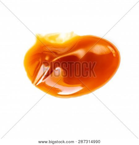 Caramel Sauce Isolated On White Background. Flowing Vanilla Toffee Sauce Top View