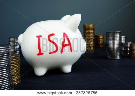 Individual Savings Account Isa Written On A Side Of Piggy Bank.